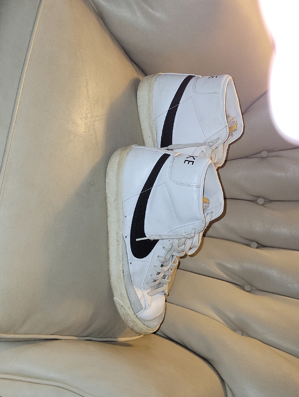 Nike White High-Top Sneakers with Black Swoosh Accent